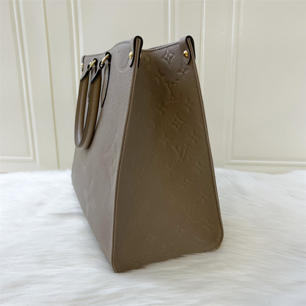 LV Onthego MM in Tourterelle Giant Monogram Empreinte Leather GHW