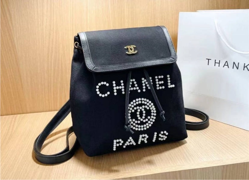 Chanel woman pearl bead Backpack