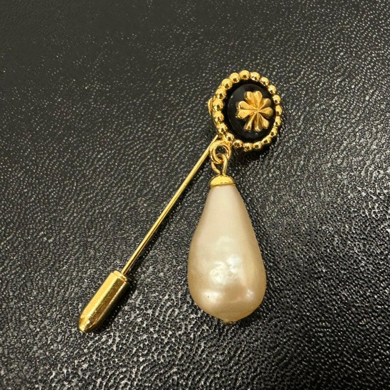 Vintage Chanel Brooch with Gold-Tone Finish and Pearl Details, Medium Size.